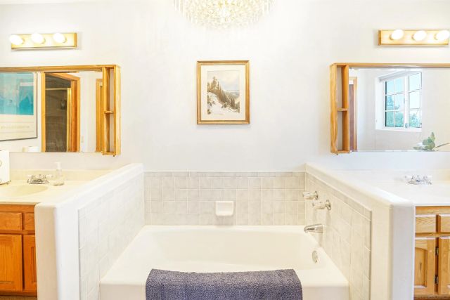 a bathroom with a bathtub and a sink