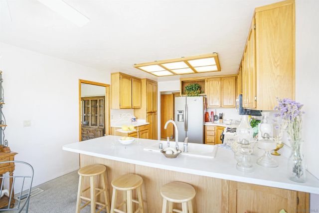 a kitchen with a table and chairs in it