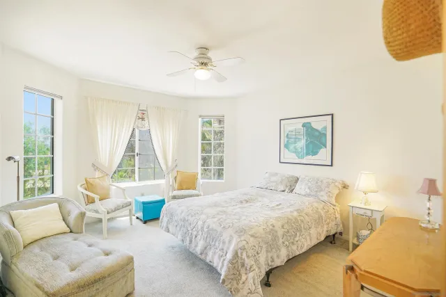 a bedroom with a bed and a couch