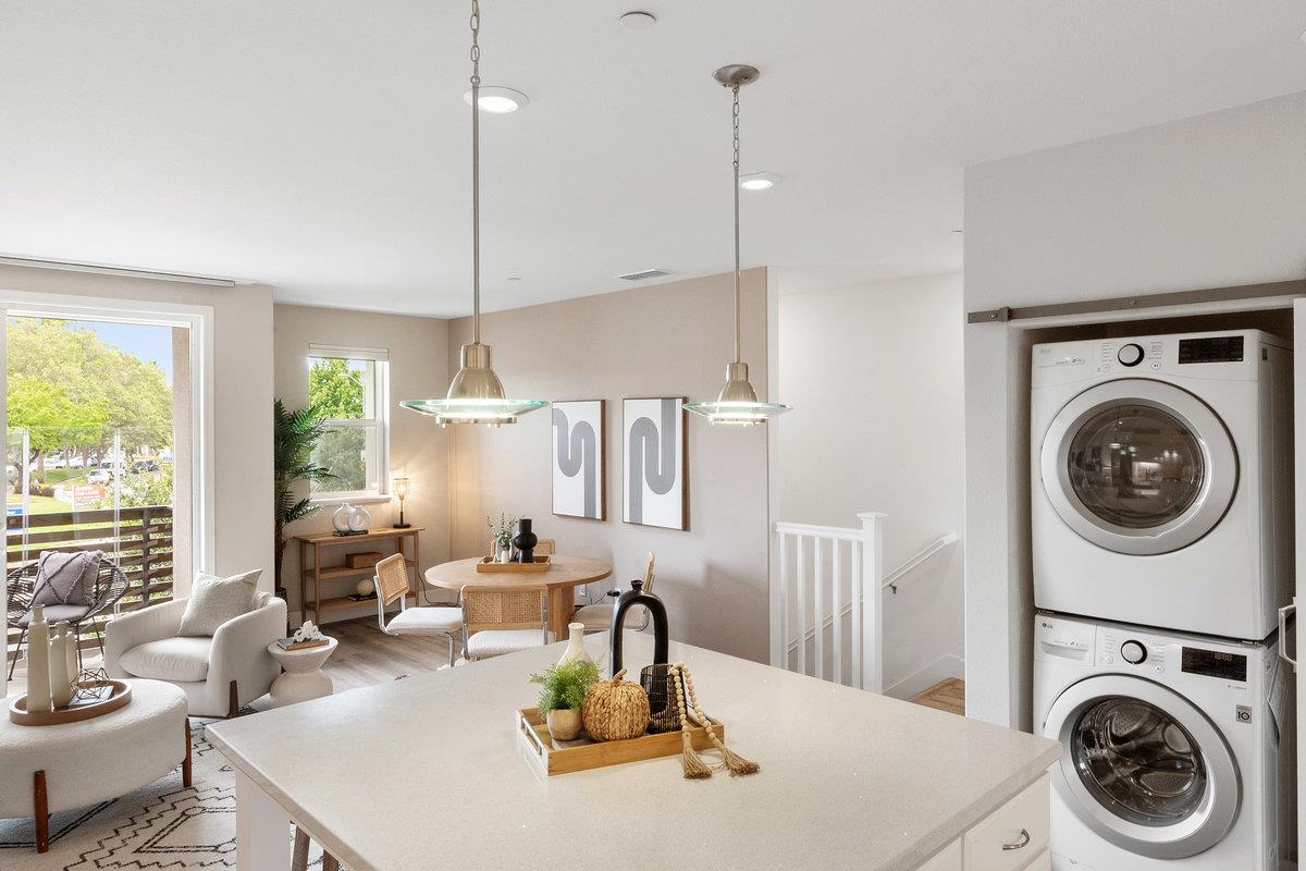 133 Stevenson Boulevard Fremont, CA 94539 - Photo 15 of 36 a kitchen with a stove a sink and a wooden floor