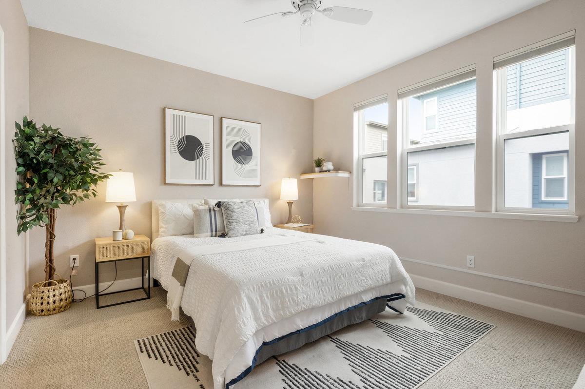 133 Stevenson Boulevard Fremont, CA 94539 - Photo 17 of 36 a bedroom with a large bed and a potted plant