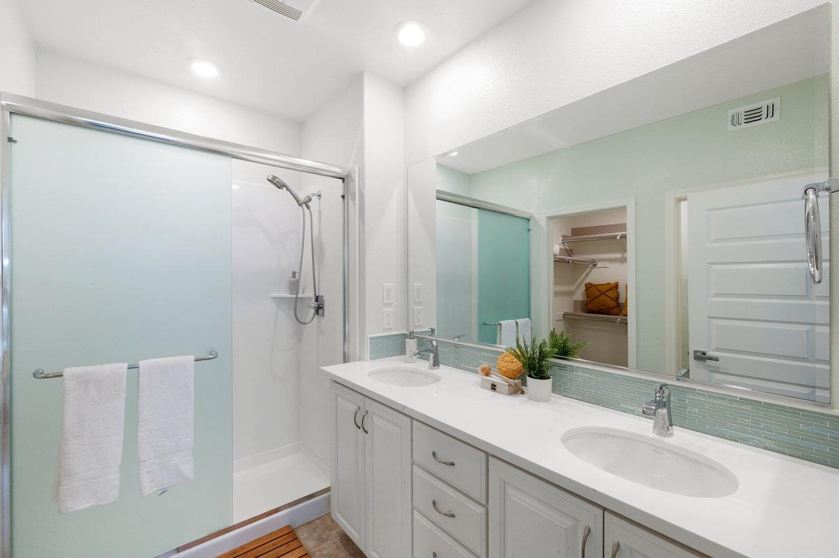 133 Stevenson Boulevard Fremont, CA 94539 - Photo 18 of 36 a bathroom with a double vanity sink mirror and double