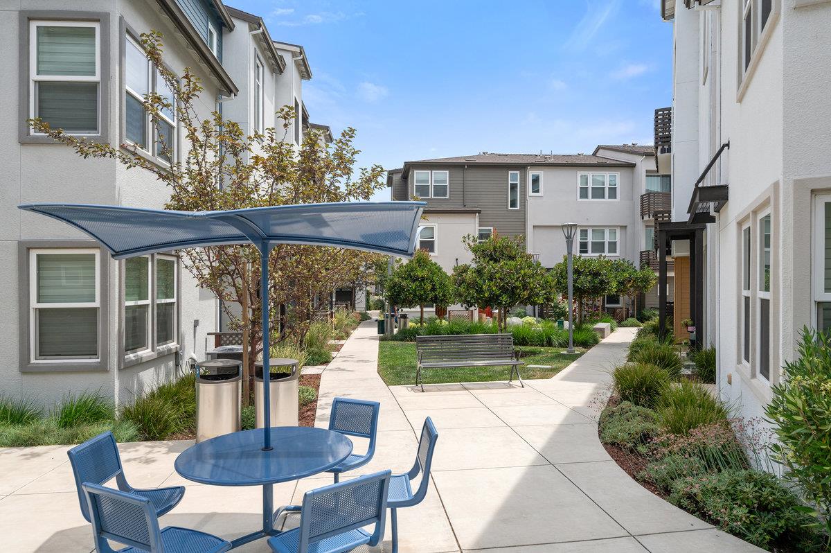 133 Stevenson Boulevard Fremont, CA 94539 - Photo 28 of 36 a view of a patio with table and chairs and potted plants