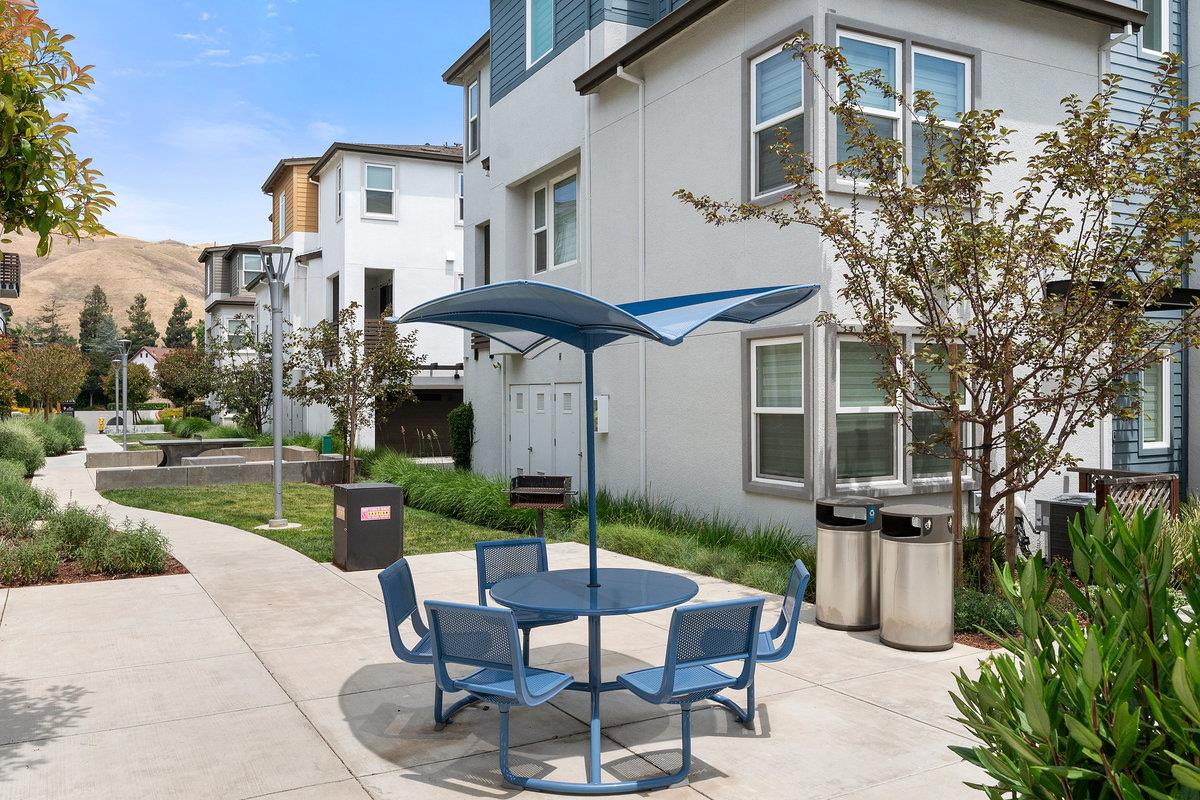 133 Stevenson Boulevard Fremont, CA 94539 - Photo 29 of 36 a view of a patio with a table and chairs under an umbrella