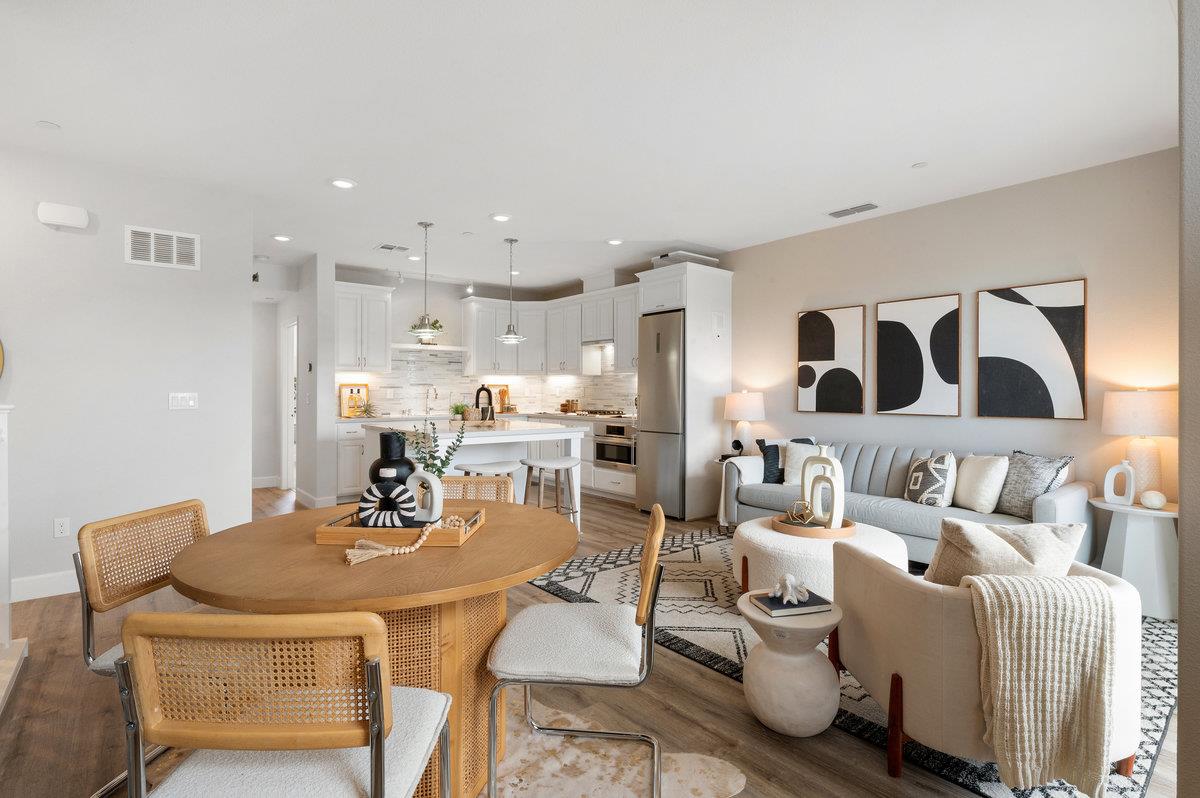 133 Stevenson Boulevard Fremont, CA 94539 - Photo 10 of 36 a living room with furniture kitchen view and a table