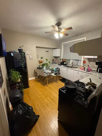 a kitchen with stainless steel appliances granite countertop a stove and a refrigerator