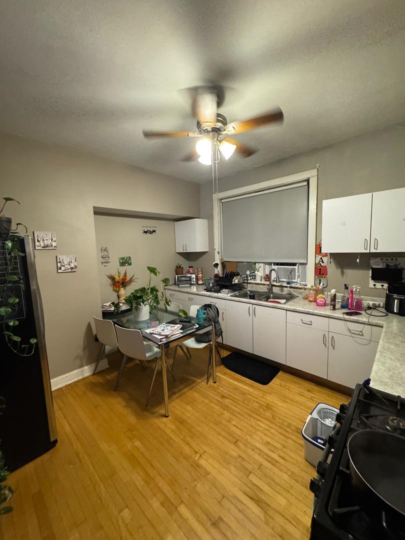 2344 South 58th Avenue, Unit 2 Cicero, IL 60804 - Photo 4 of 11 a kitchen with a sink appliances and cabinets