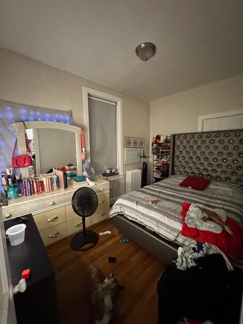 2344 South 58th Avenue, Unit 2 Cicero, IL 60804 - Photo 5 of 11 a room with furniture and a flat screen tv