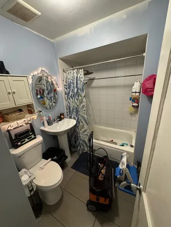 a bathroom with a toilet and a sink
