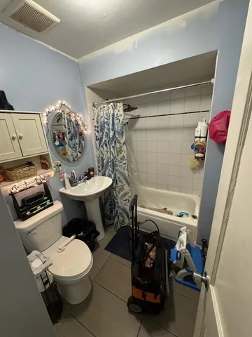 a bathroom with a toilet and a sink