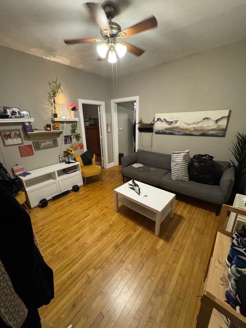 2344 South 58th Avenue, Unit 2 Cicero, IL 60804 - Photo 10 of 11 a living room with furniture and a table
