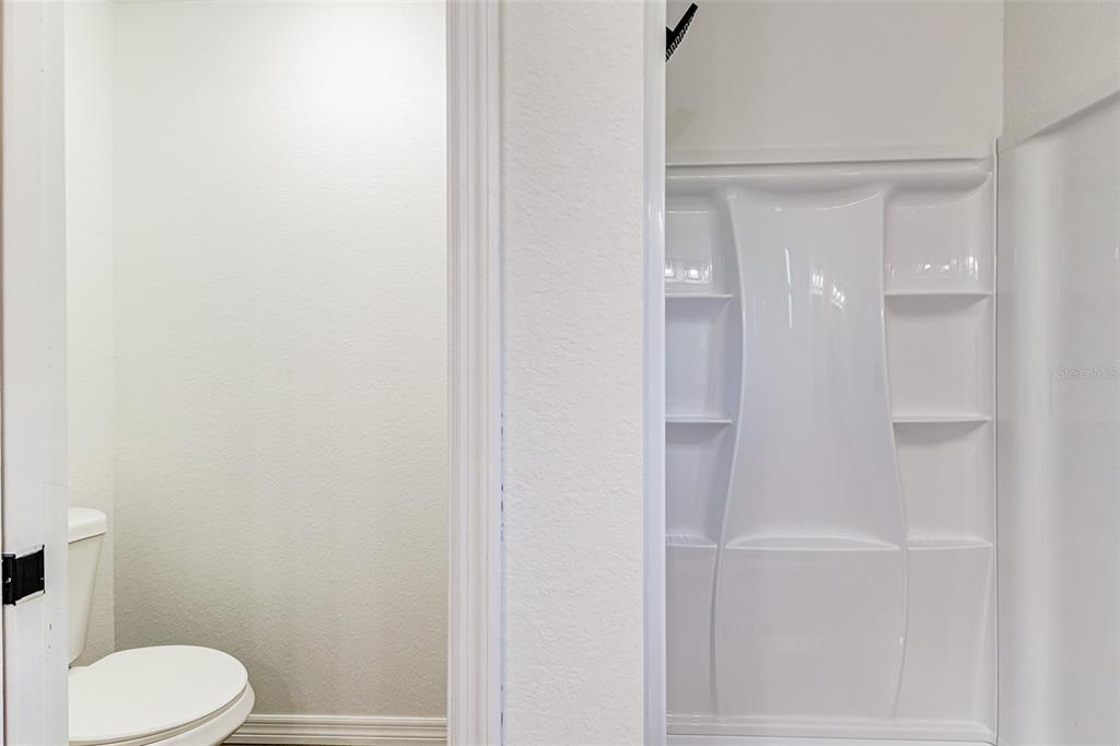 2728 Golfview Street Lakeland, FL 33801 - Photo 16 of 25 a bathroom with a toilet and a shower