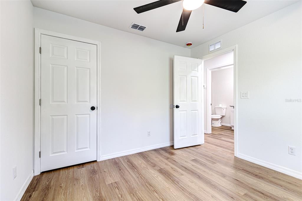 2728 Golfview Street Lakeland, FL 33801 - Photo 22 of 25 an empty room with wooden floor and windows