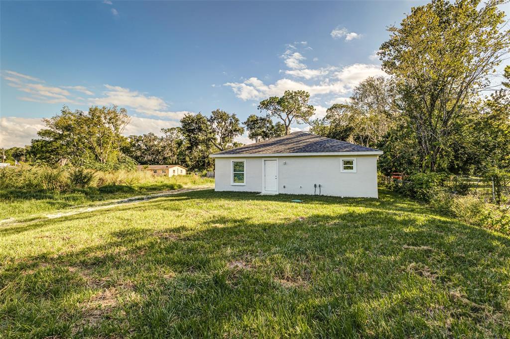 2728 Golfview Street Lakeland, FL 33801 - Photo 25 of 25 a view of a house with a yard