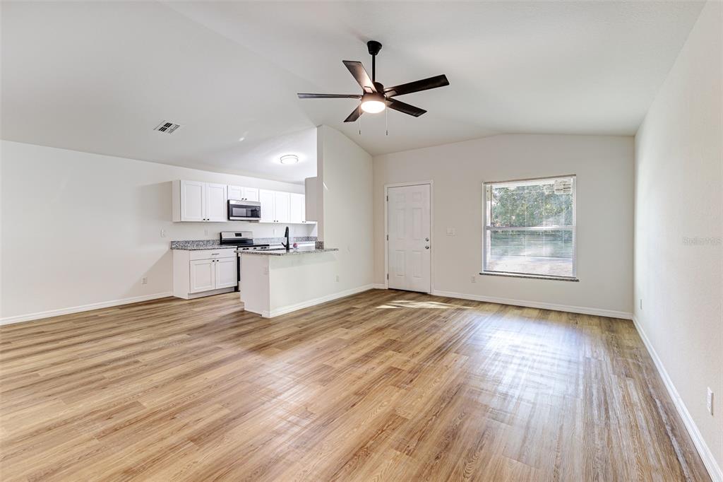 2728 Golfview Street Lakeland, FL 33801 - Photo 6 of 25 a view of empty room with wooden floor and window