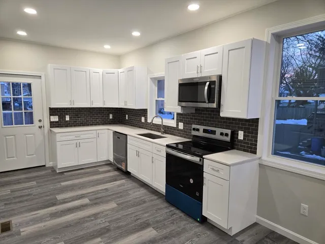 a view of entryway with wooden floor