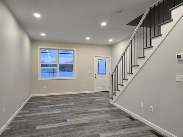 a view of entryway with wooden floor