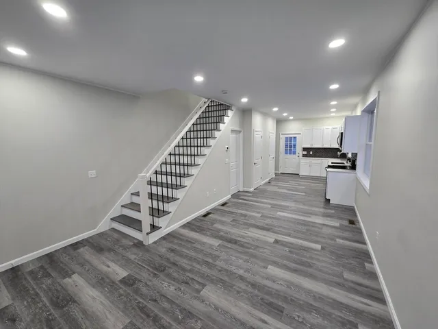 a bathroom with a toilet sink and a mirror