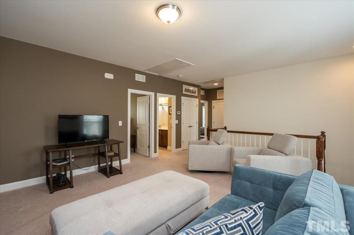 1552 Crafton Way Raleigh, NC 27607 - Photo 17 of 27 Open bonus room space-gathering space outside bedrooms.