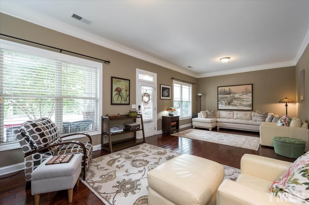 1552 Crafton Way Raleigh, NC 27607 - Photo 7 of 27 Living room and family room could be combined as one larger space.