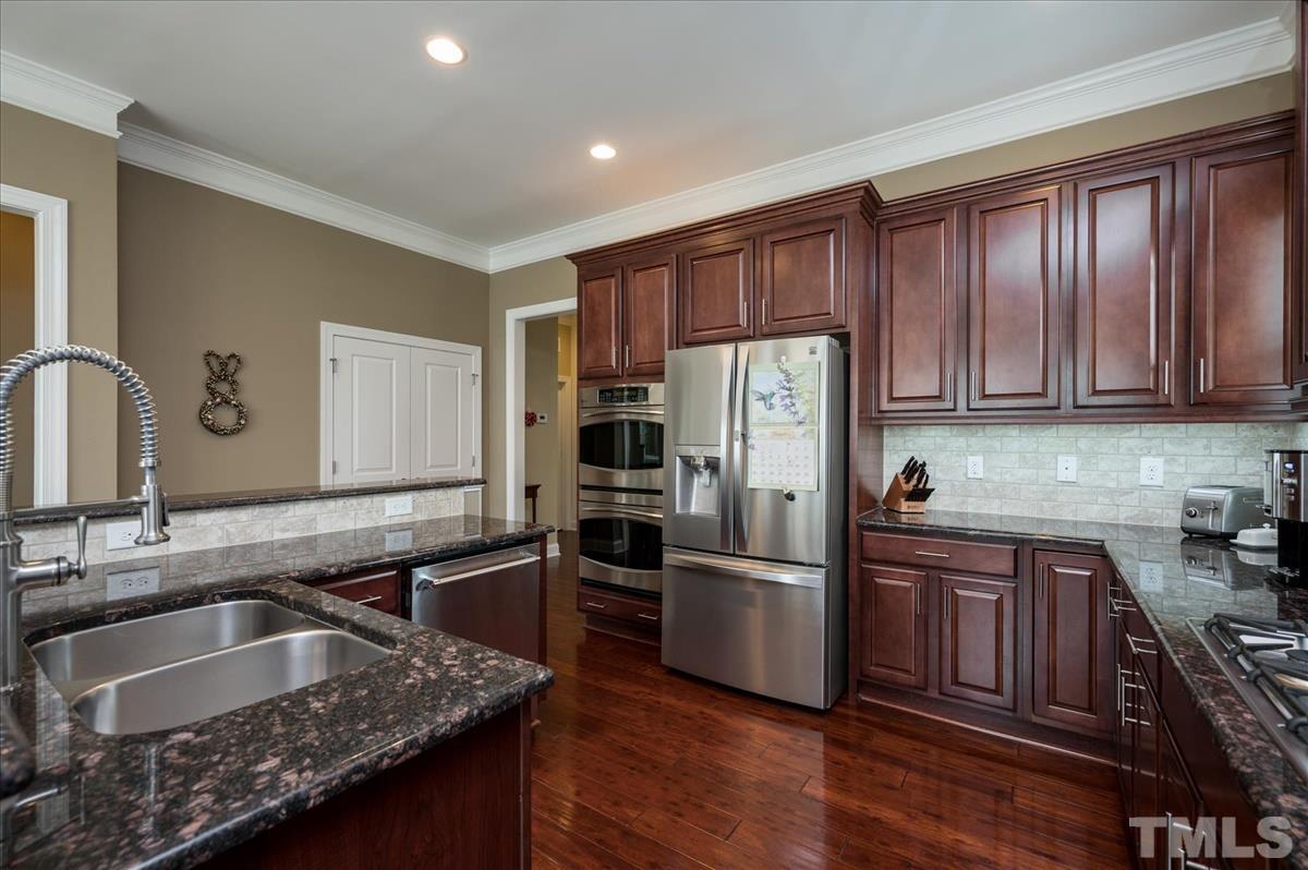1552 Crafton Way Raleigh, NC 27607 - Photo 10 of 27 Newer refrigerator conveys with home.