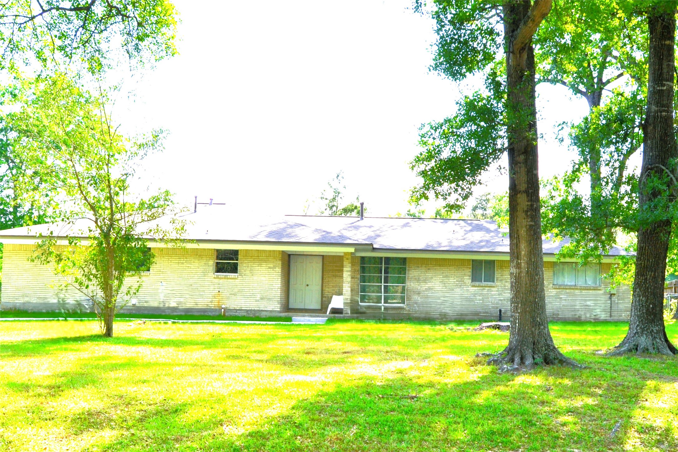 101 Summit Drive Conroe, TX 77303 - Photo 2 of 24 a view of a swimming pool with a yard