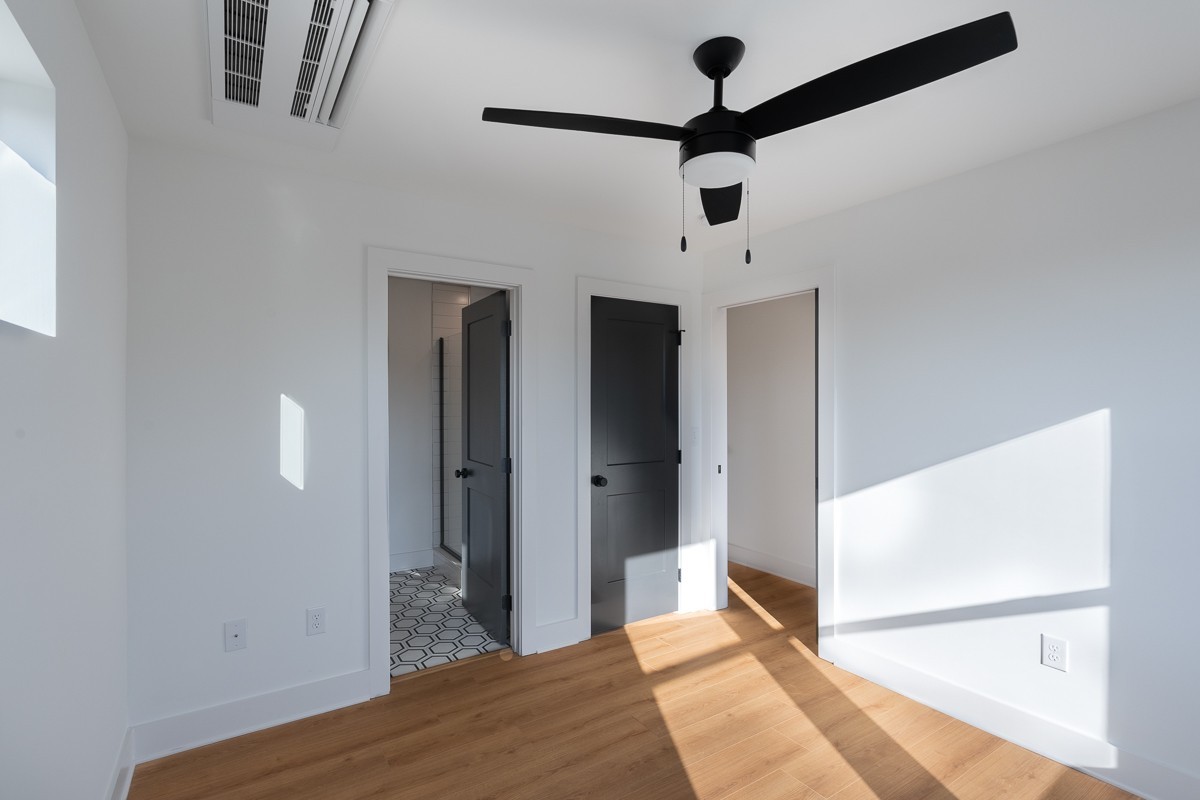 102 Duke Street, Unit 8 Nashville, TN 37207 - Photo 11 of 29 a bedroom with a bed and a chandelier fan