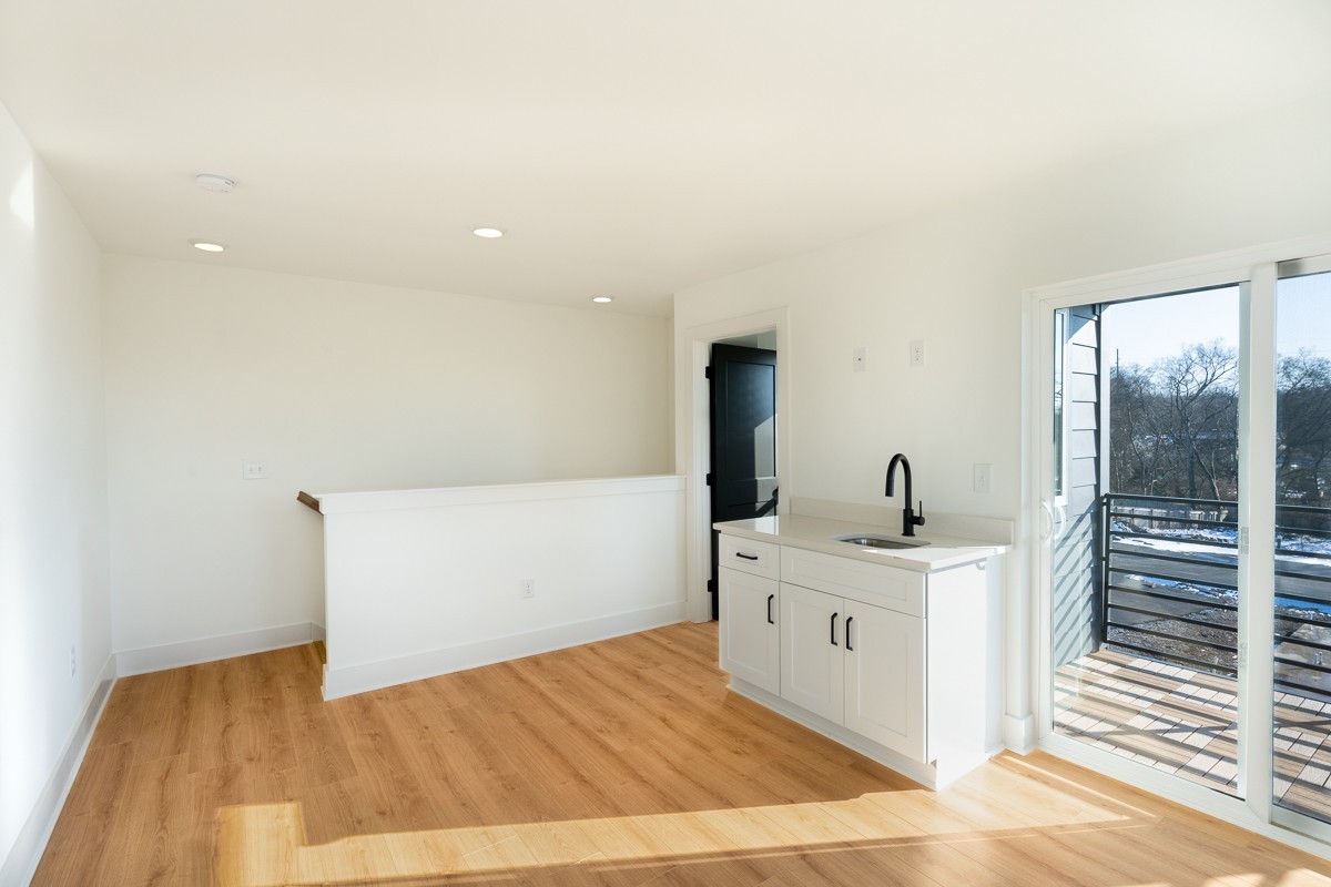 102 Duke Street, Unit 8 Nashville, TN 37207 - Photo 20 of 29 a room with a sink and a wooden floor