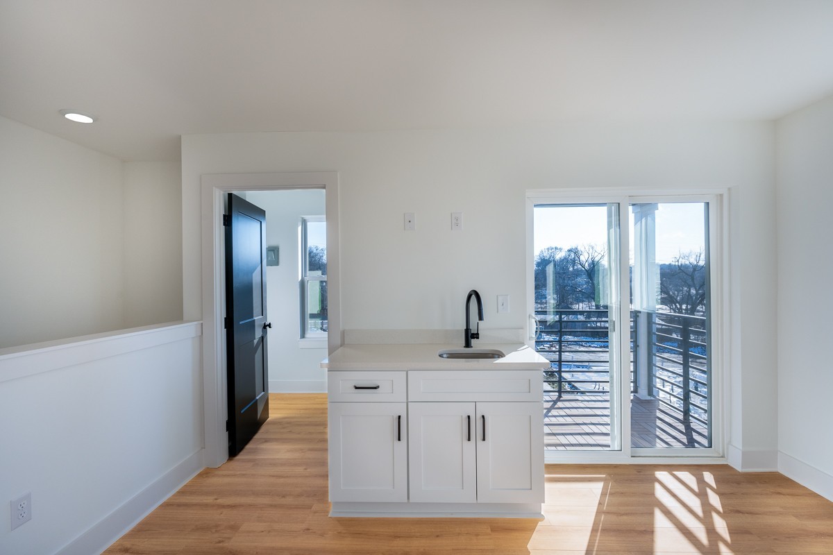 102 Duke Street, Unit 8 Nashville, TN 37207 - Photo 21 of 29 a bathroom with a sink and a mirror