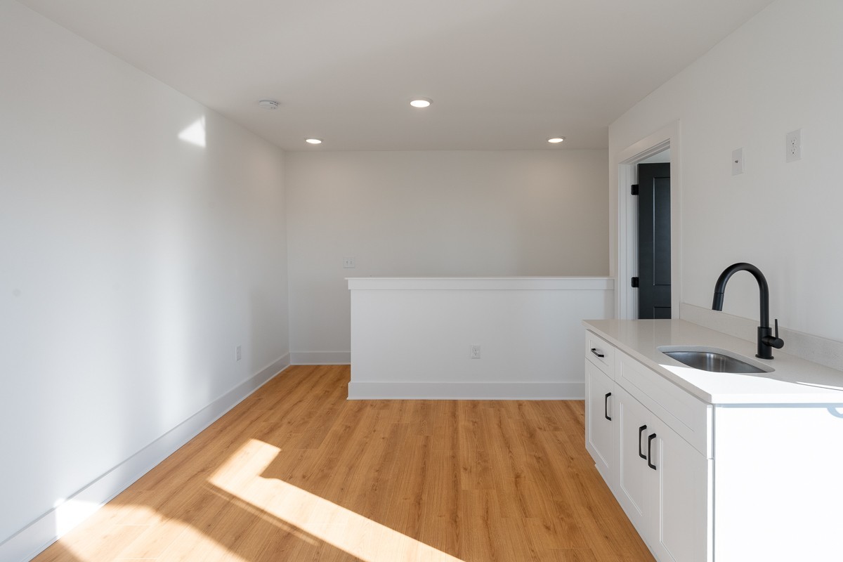 102 Duke Street, Unit 8 Nashville, TN 37207 - Photo 24 of 29 a kitchen with a sink and wooden floor