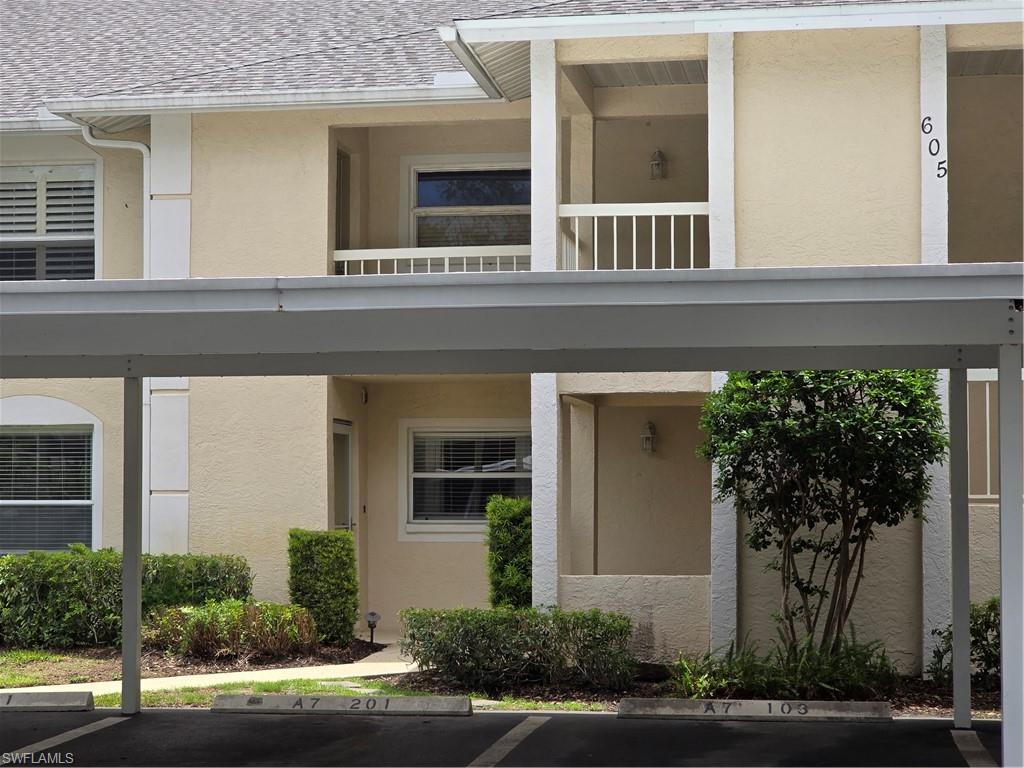 605 Squire Circle, Unit 203 Naples, FL 34104 - Photo 2 of 36 front view of a house