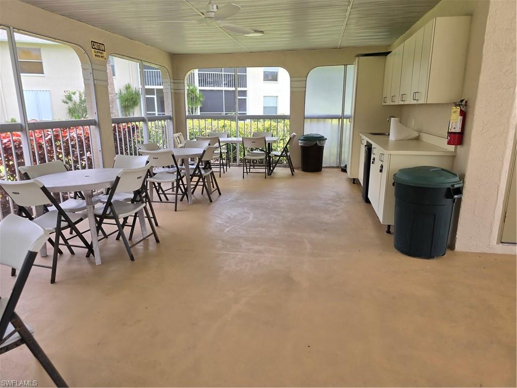 605 Squire Circle, Unit 203 Naples, FL 34104 - Photo 26 of 36 a view of a dining room with furniture window and outside view