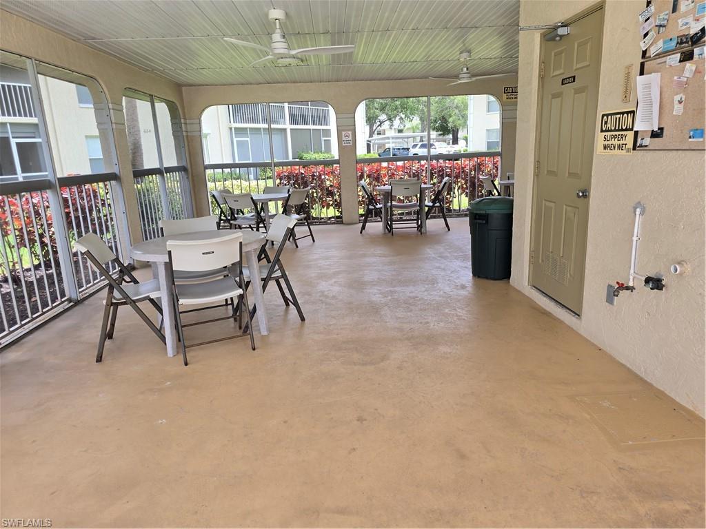 605 Squire Circle, Unit 203 Naples, FL 34104 - Photo 27 of 36 a view of a dining room with furniture window and outside view