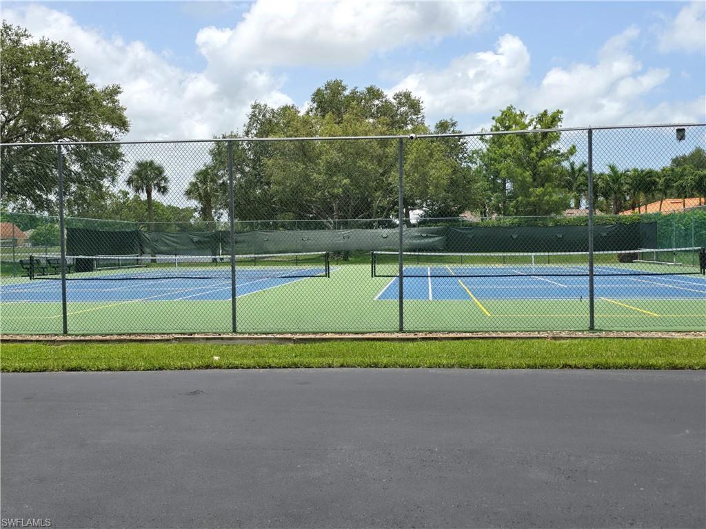 605 Squire Circle, Unit 203 Naples, FL 34104 - Photo 28 of 36 a view of a tennis court