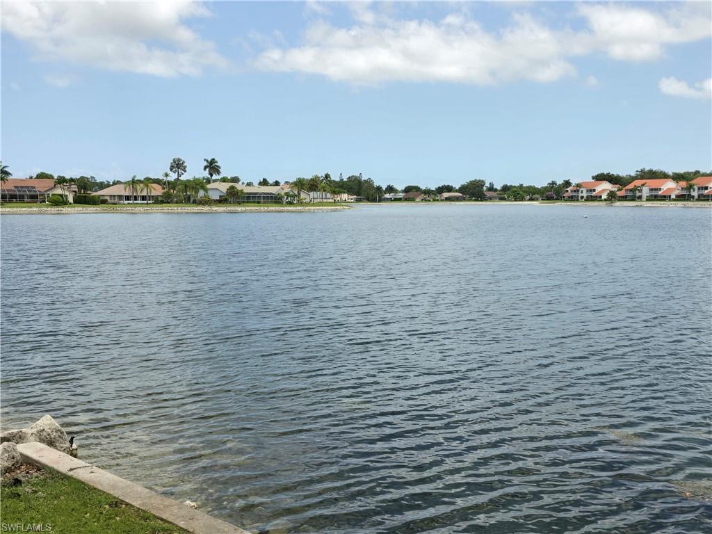 605 Squire Circle, Unit 203 Naples, FL 34104 - Photo 31 of 36 a view of a lake and city