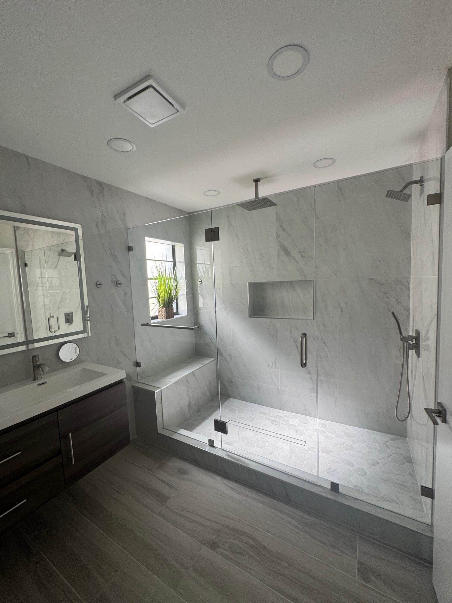 8711 Eagle Run Drive Boca Raton, FL 33434 - Photo 9 of 17 a bathroom with double vanity sink and a mirror