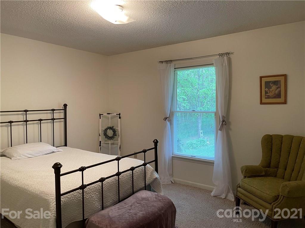 224 Lynch Street Rutherfordton, NC 28139 - Photo 13 of 23 a bedroom with a bed and a window