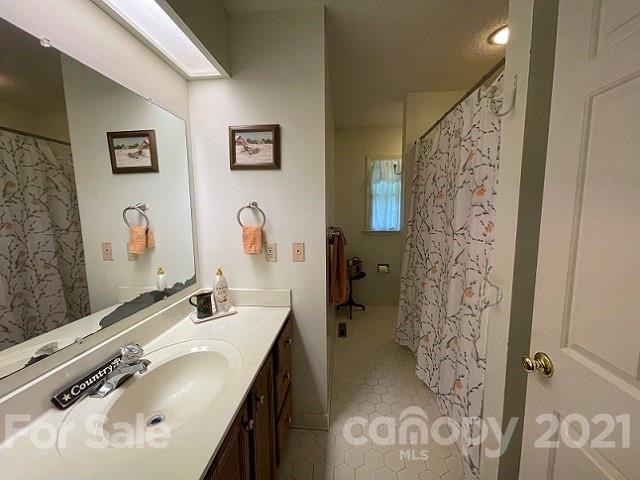 224 Lynch Street Rutherfordton, NC 28139 - Photo 14 of 23 a bathroom with a sink and a mirror