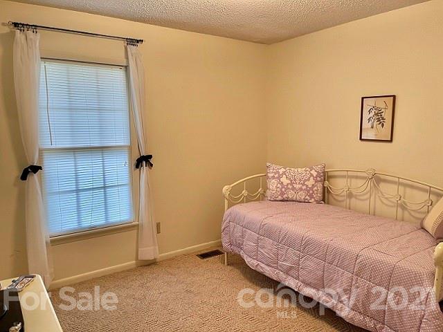 224 Lynch Street Rutherfordton, NC 28139 - Photo 18 of 23 a bedroom with a bed and a window