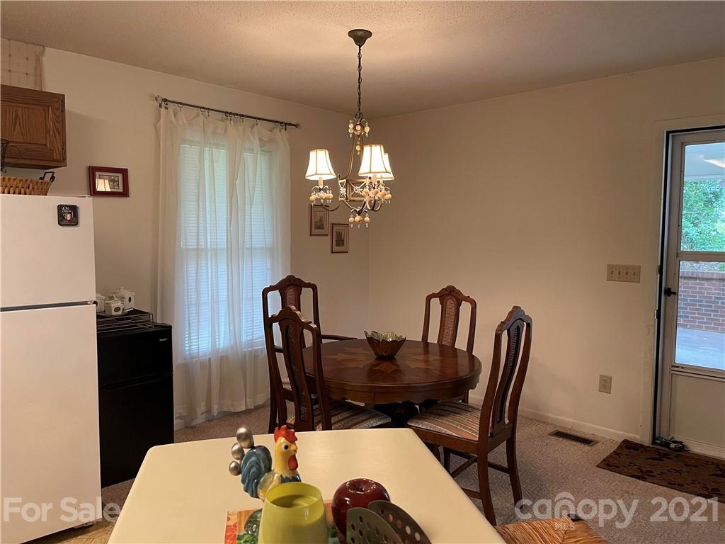224 Lynch Street Rutherfordton, NC 28139 - Photo 4 of 23 a view of a dining room with furniture window and wooden floor