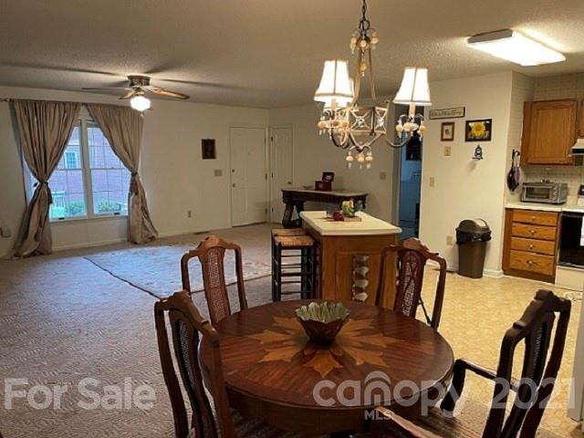 224 Lynch Street Rutherfordton, NC 28139 - Photo 7 of 23 a view of a dining room with furniture and wooden floor