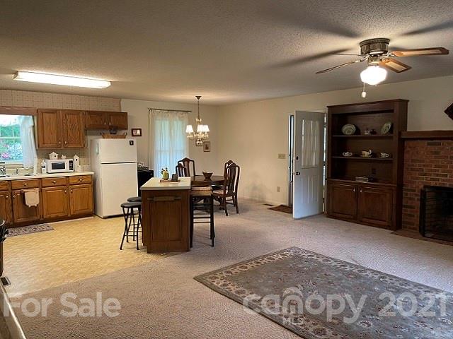224 Lynch Street Rutherfordton, NC 28139 - Photo 8 of 23 a living room with furniture a dining table and kitchen view