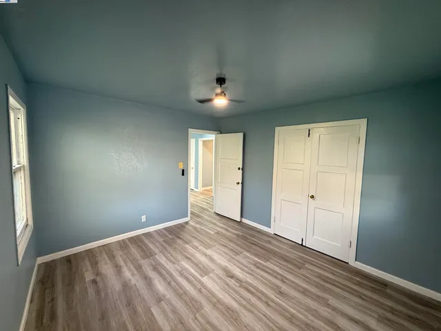 a view of a hallway with paintings on the wall