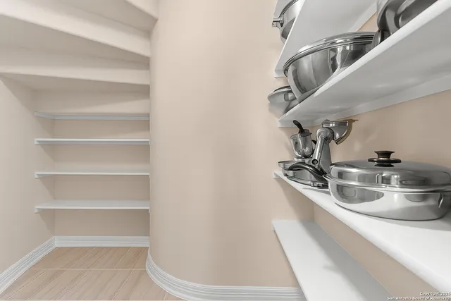 a kitchen with a sink and a stove top oven