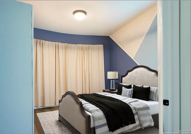 a bedroom with a bed and window