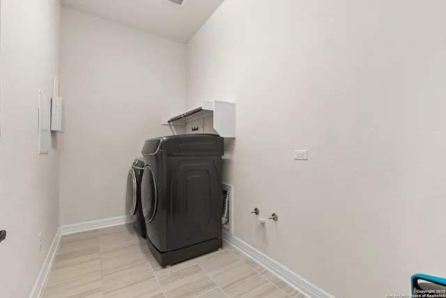 a utility room with washer and dryer