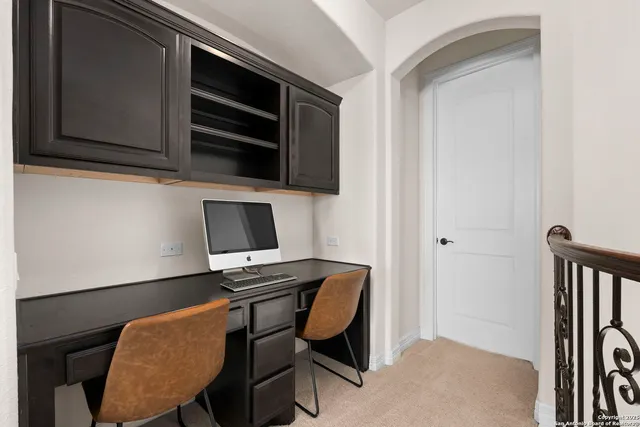 a view of a workspace with furniture