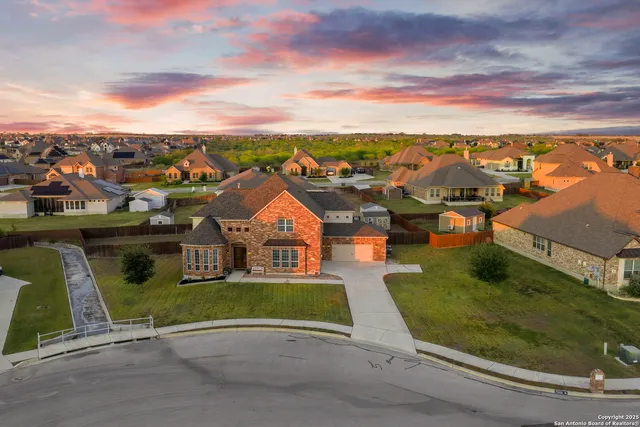 an aerial view of a house with a garden space