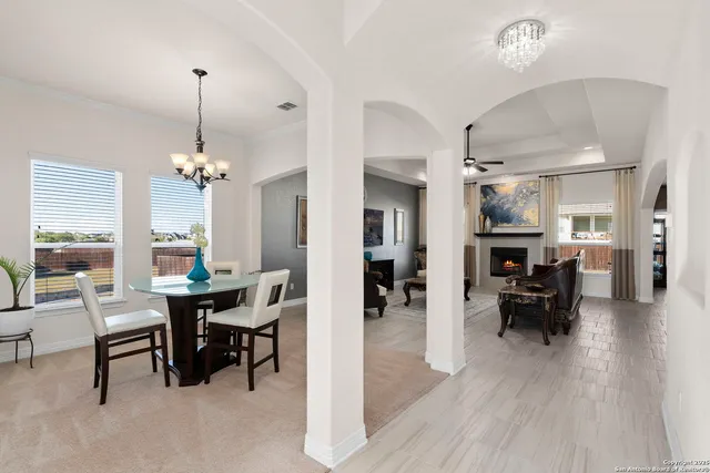 a view of a dining room with furniture window and wooden floor