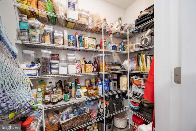 a kitchen with stainless steel appliances granite countertop a refrigerator stove microwave and sink